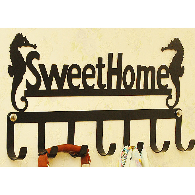 Black wall metal coat rack with with 7 hangers and letters 