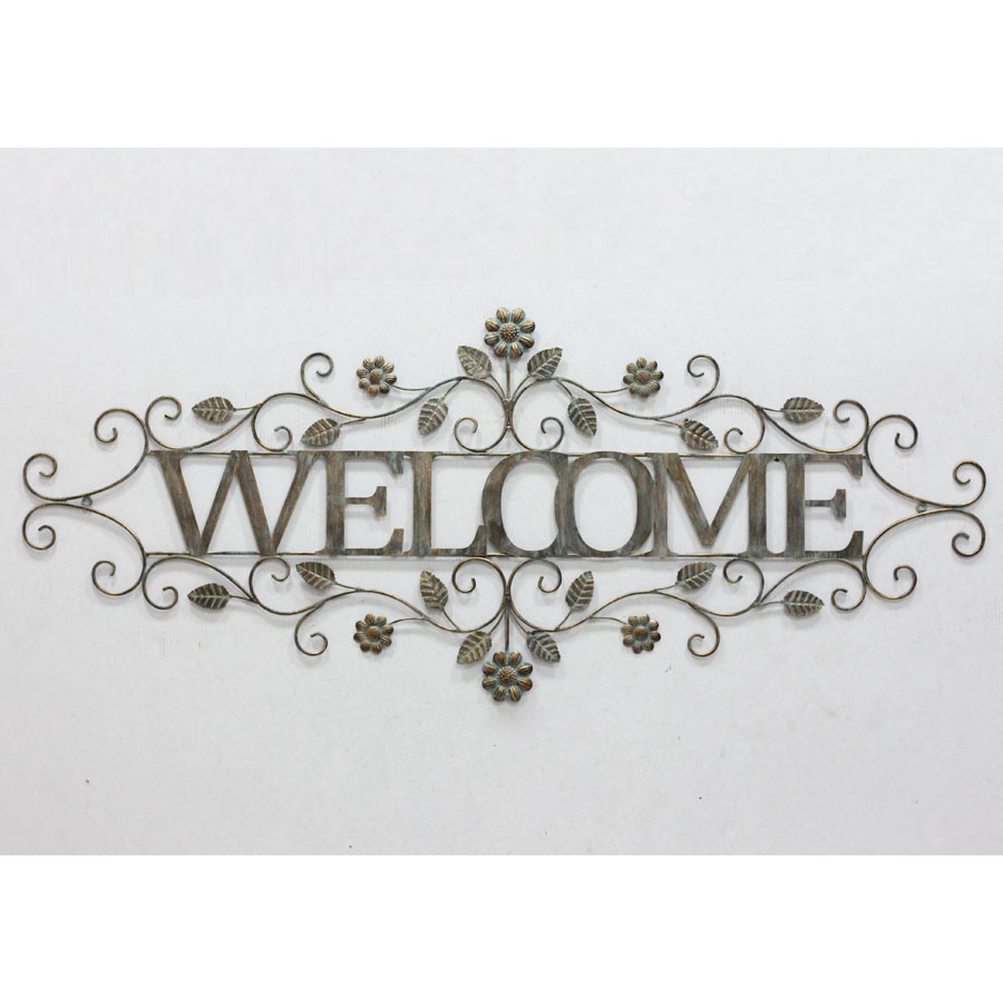 Metal wall decor with leaves and flowers and welcome board