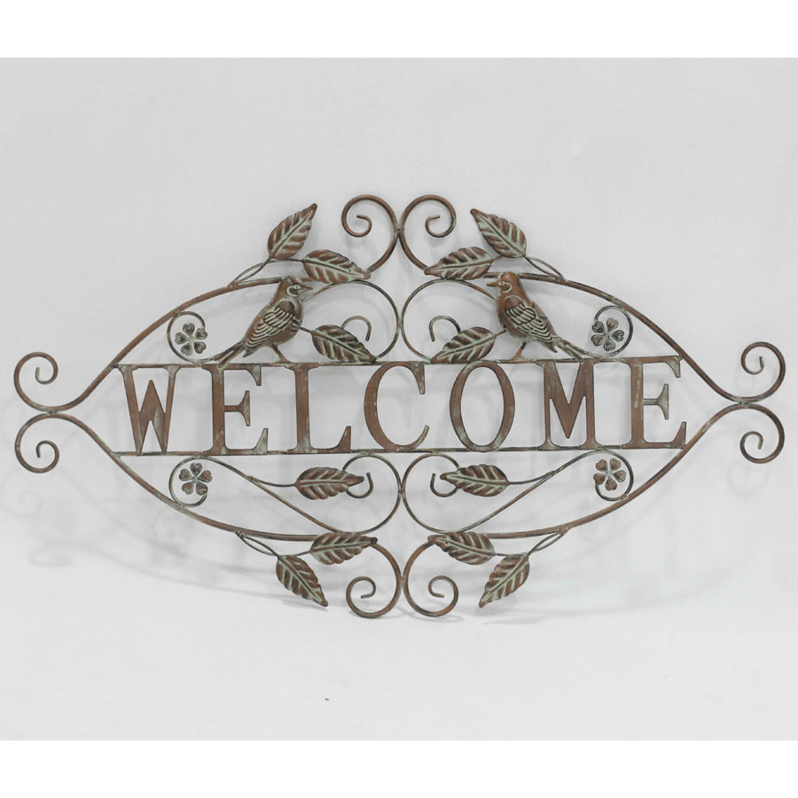 Metal wall decor with leaves and flowers and welcome board