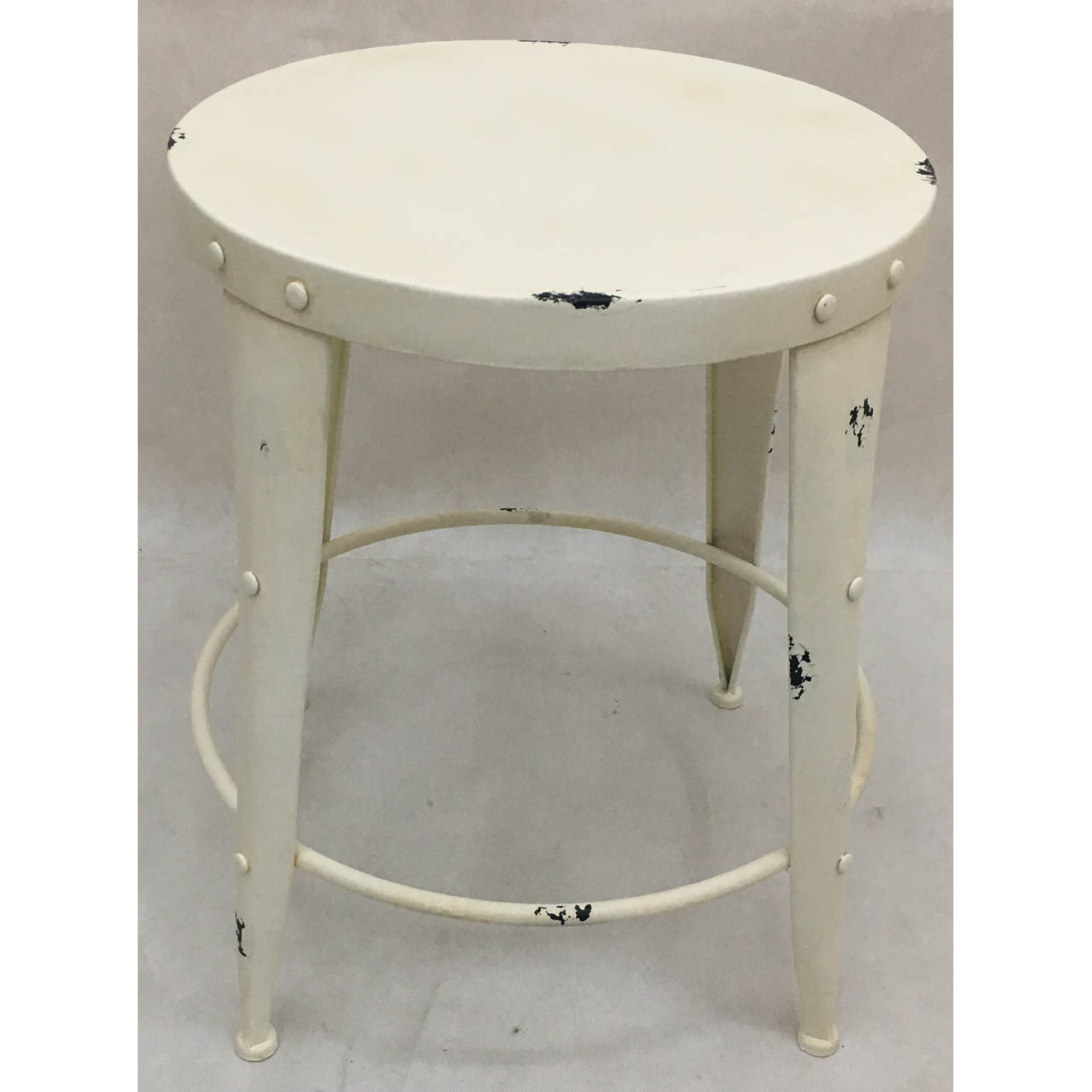 Distressed white round metal side table