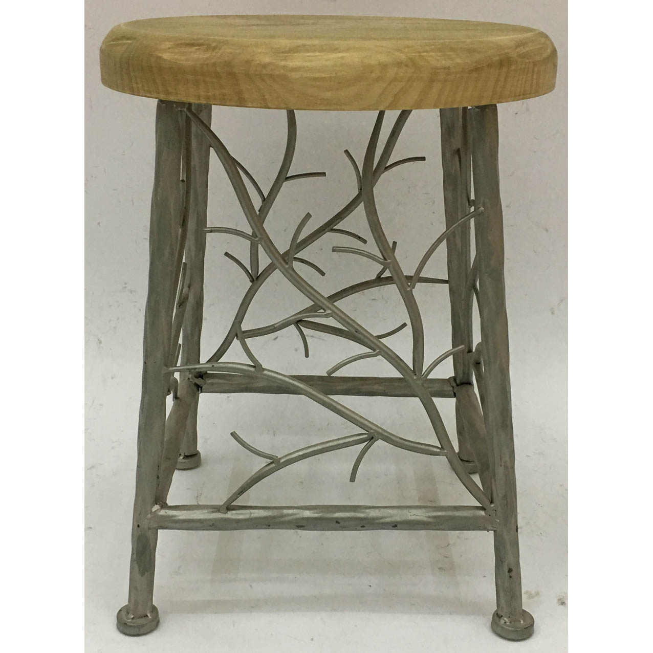 Round metal side table with natural look solid wood and growing tree decor
