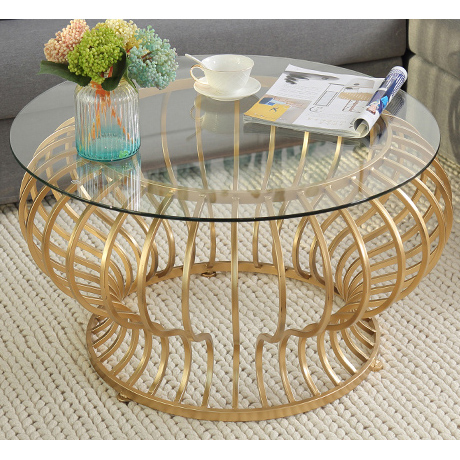 Gold round metal coffee table with clear glass top & curved metal base