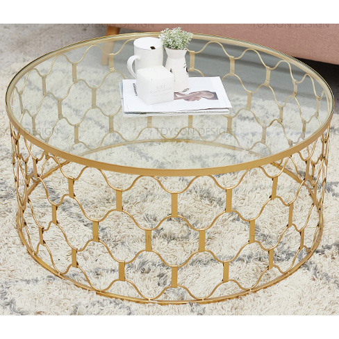 Gold round metal coffee table with clear glass top & weaving wire wave decor base