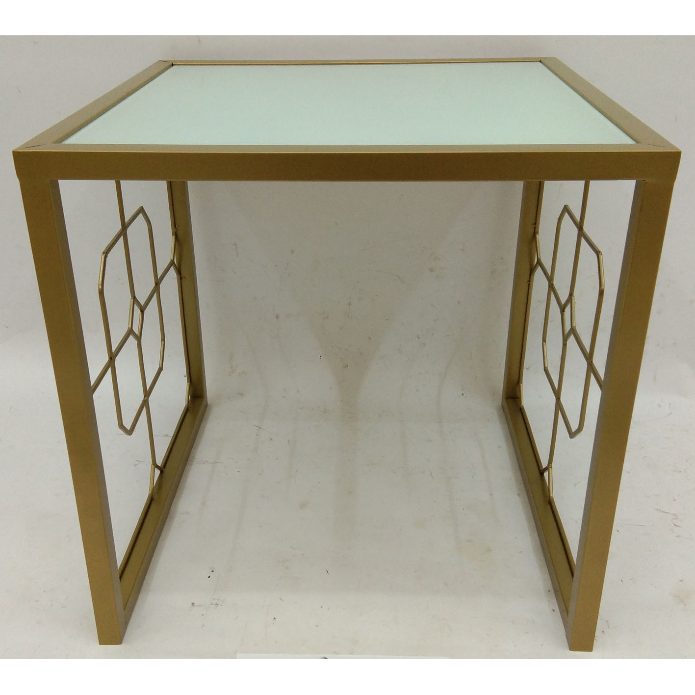 Gold square metal side table with white glass top and geometric metal side decor